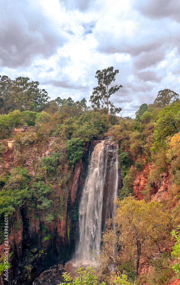 Fototapeta premium Waterfall on the Victoria Lake of Kenya under a cloudy day