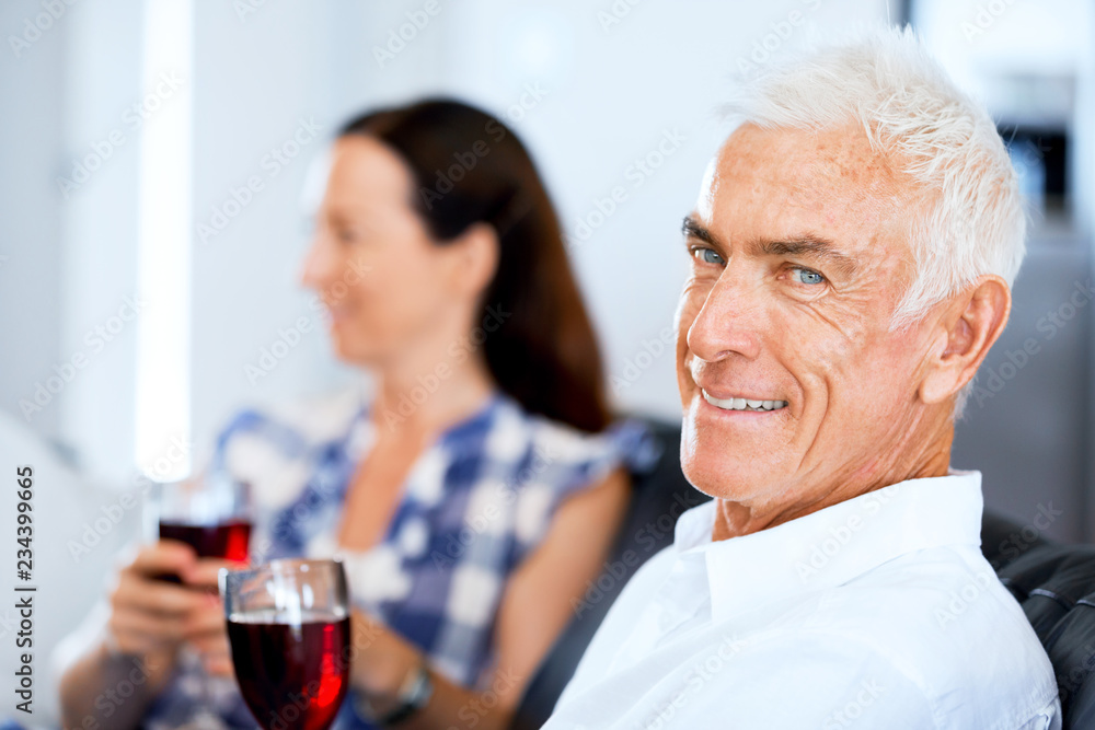 Portrait of a couple having a glass of red wine Portrait of a couple having a glass of red wine