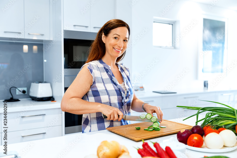 Beautiful woman standing in the kitchen