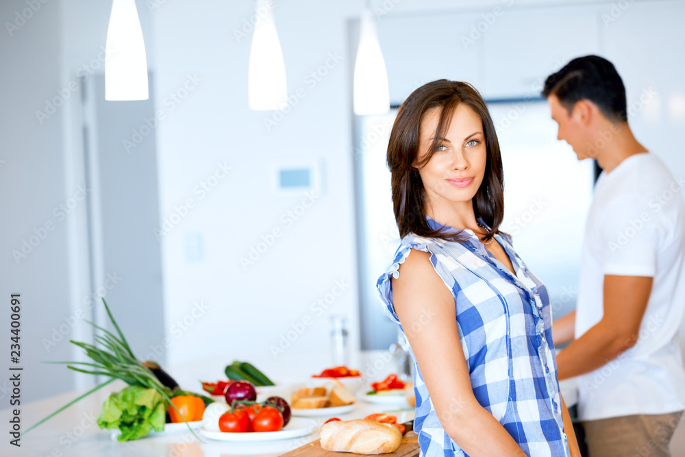 Couple cooking together at home Couple cooking together at home