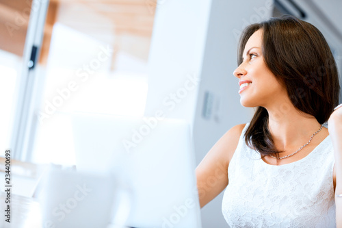 Young beautiful woman working on her laptop Free Download Young beautiful woman working on her laptop - GFXLoad