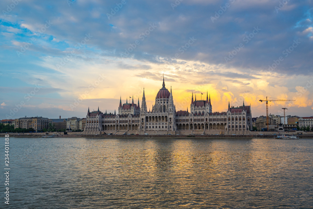 Sunset view of Budapest Parliament Building with view of Danube River in Hungary