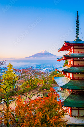 Beautiful landscape of mountain fuji with chureito pagoda around maple leaf tree in autumn season photo