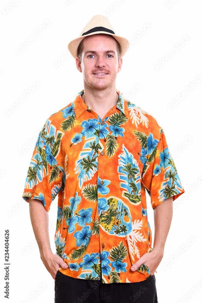 Studio shot of happy man smiling ready for vacation Studio shot of happy man smiling ready for vacation