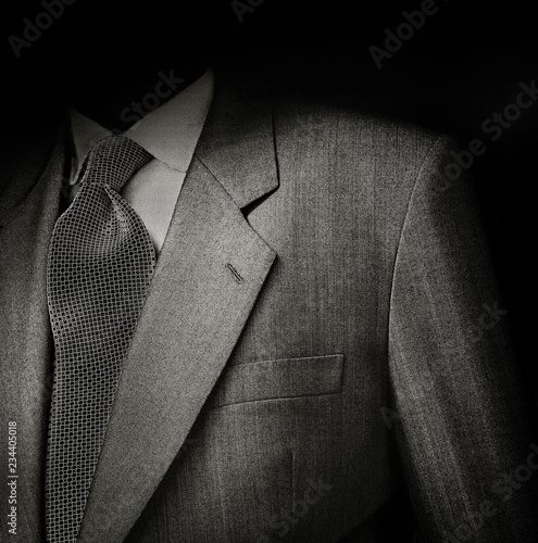 Fotografia Man suit in black with a sinister light effect