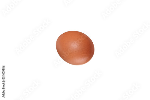 Brown chicken egg on a white background. Isolated photo.