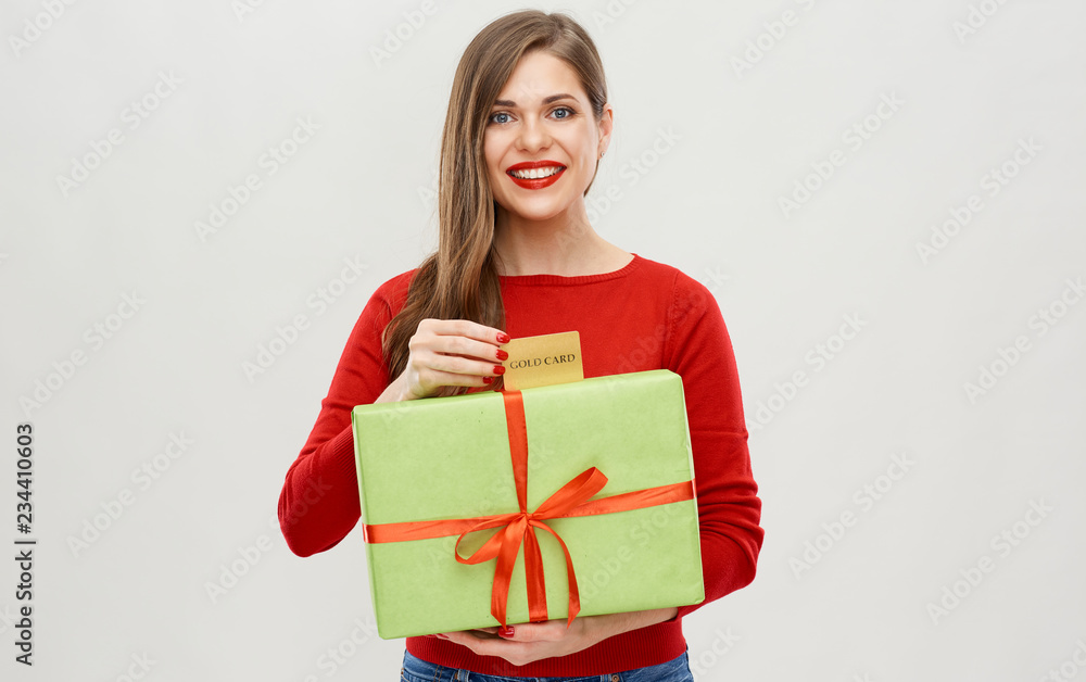 happy woman holding gift box with credit card happy woman holding gift box with credit card