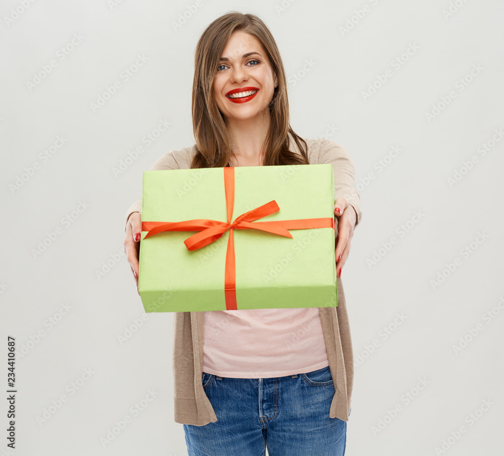 Fototapeta premium Happy woman holding green gift box.