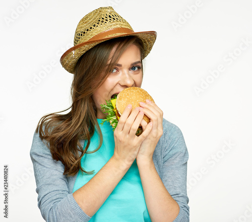 close up portrait of woman eating burger.