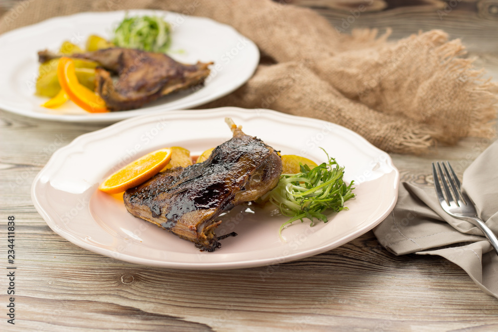 Duck leg confit with orange and herbs