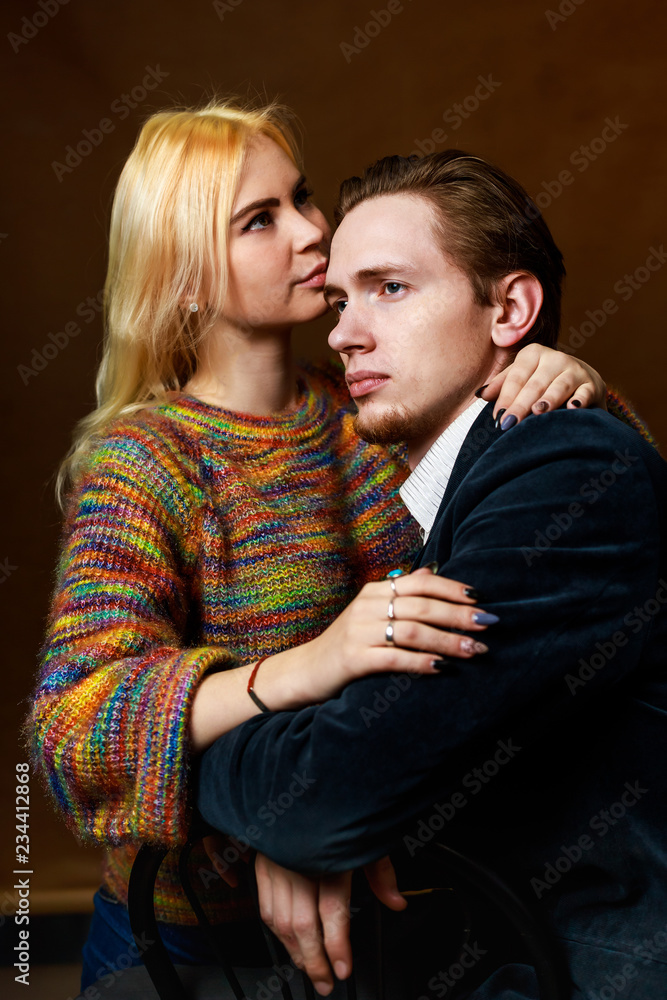 Young couple: dramatic portrait. Girl and boy together Young couple: dramatic portrait. Girl and boy together