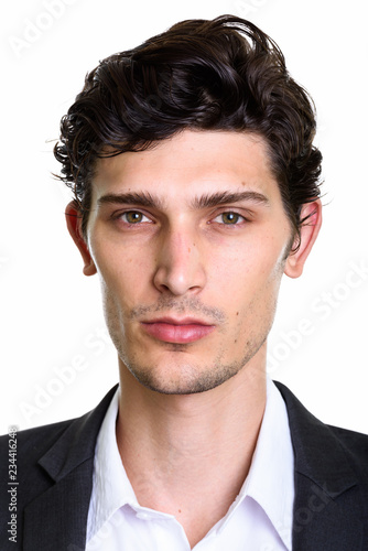 Face of young handsome Brazilian businessman looking at camera