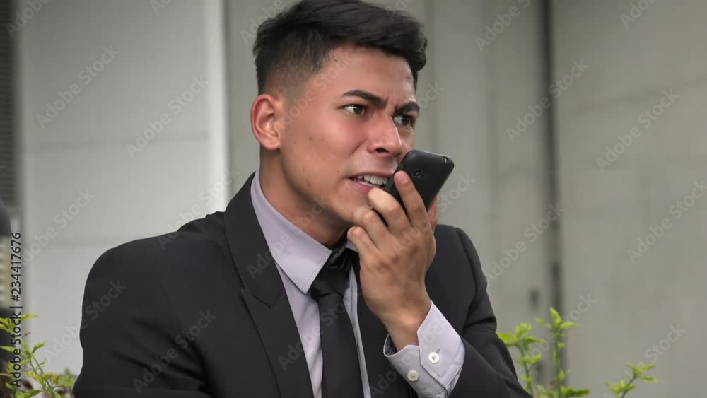 Angry Handsome Adult Hispanic Man Using Phone