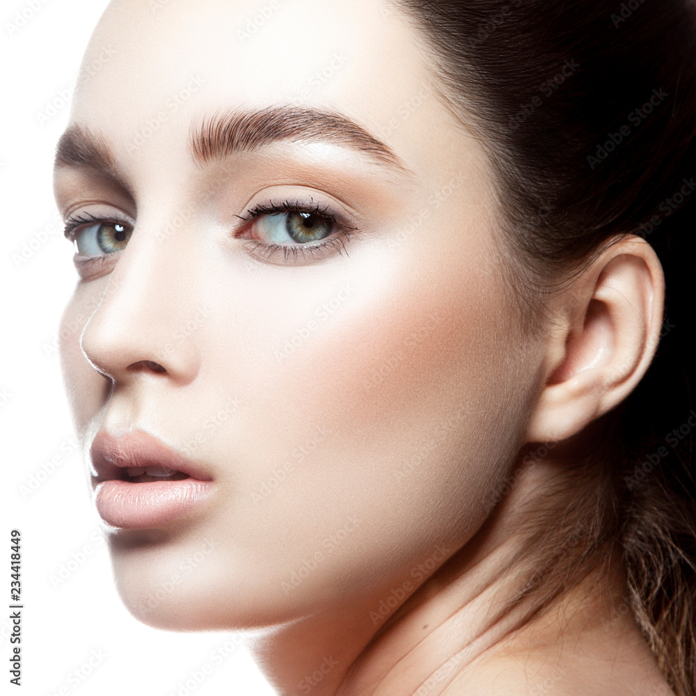 Close-up beauty model girl prety with clean skin, natural lips, nude  lipstick make-up, blue eyes. Brunette hair. White background. Skincare  facial treatment female health concept Stock Photo | Adobe Stock