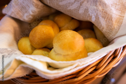 Traditional Mennonite zwieback bread rolls in basket for holiday meal photo