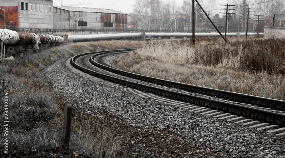 railway in the industrial zone..empty rails with a semaphore, in anticipation of a freight train.