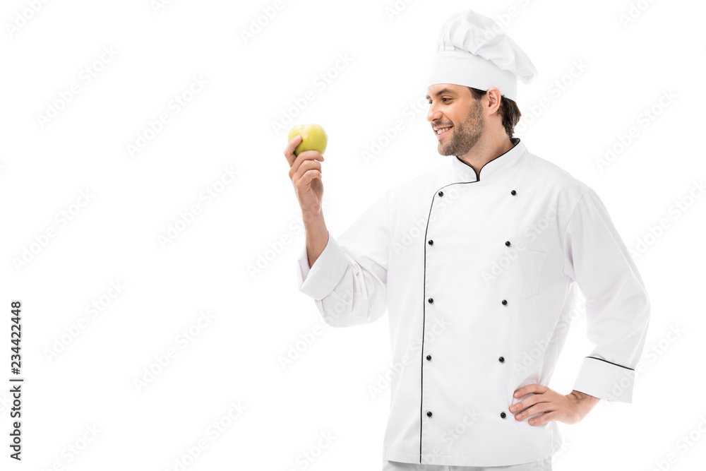 smiling male chef holding fresh apple isolated on white smiling male chef holding fresh apple isolated on white