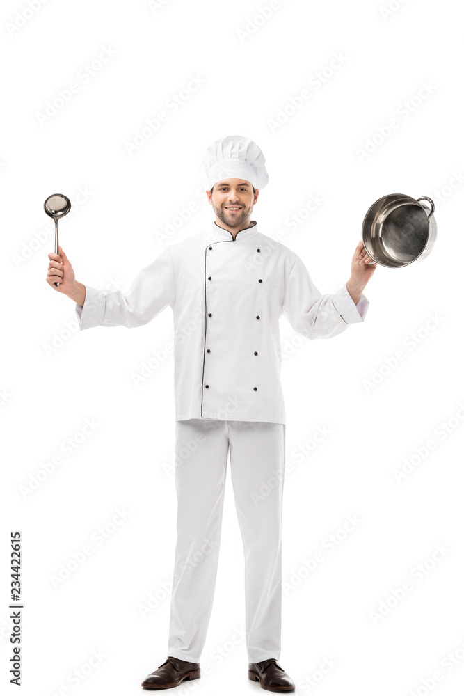 handsome smiling chef holding ladle and pan isolated on white handsome smiling chef holding ladle and pan isolated on white