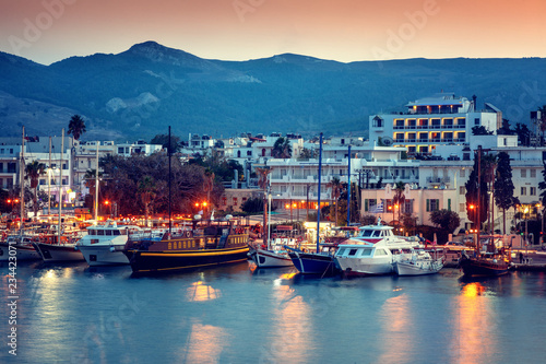 Fototapeta Naklejka Na Ścianę i Meble -  The capital of the island of Kos, Greece, view of the city and marina at sunset, a popular destination for travel in Europe