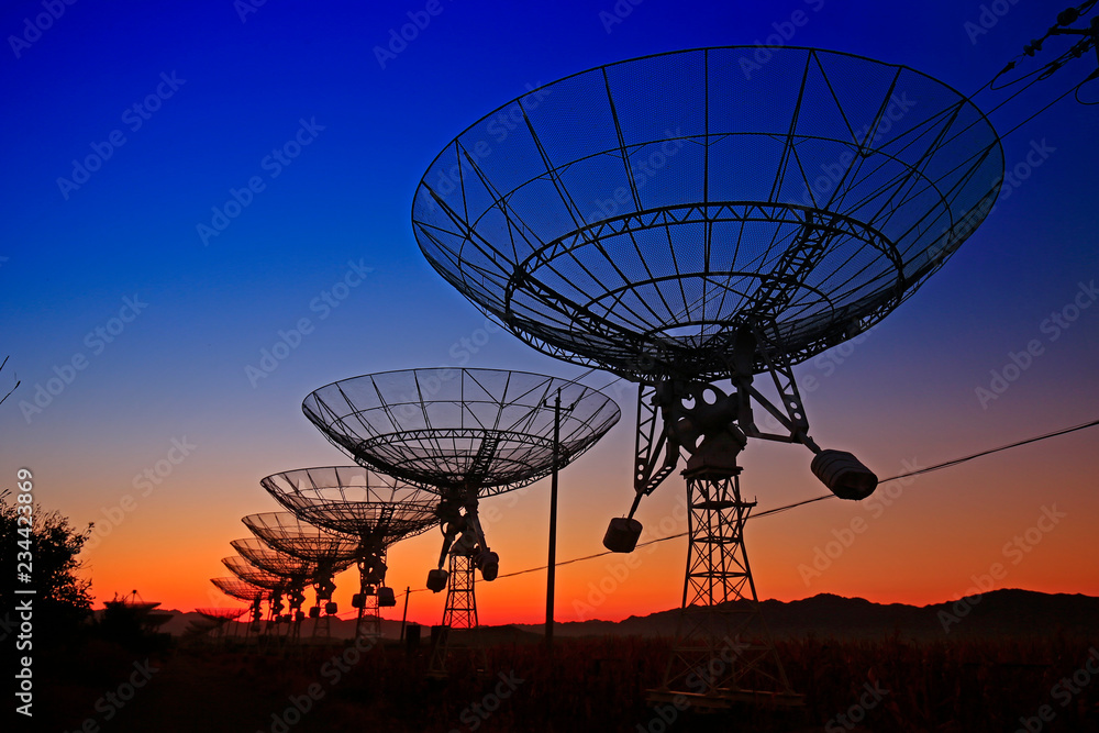 The silhouette of a radio telescope observatory The silhouette of a radio telescope observatory