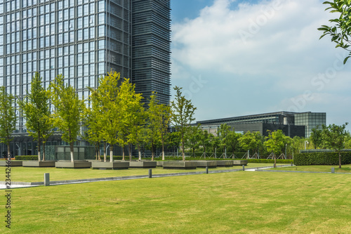 beautiful green field near modern office building. © hallojulie