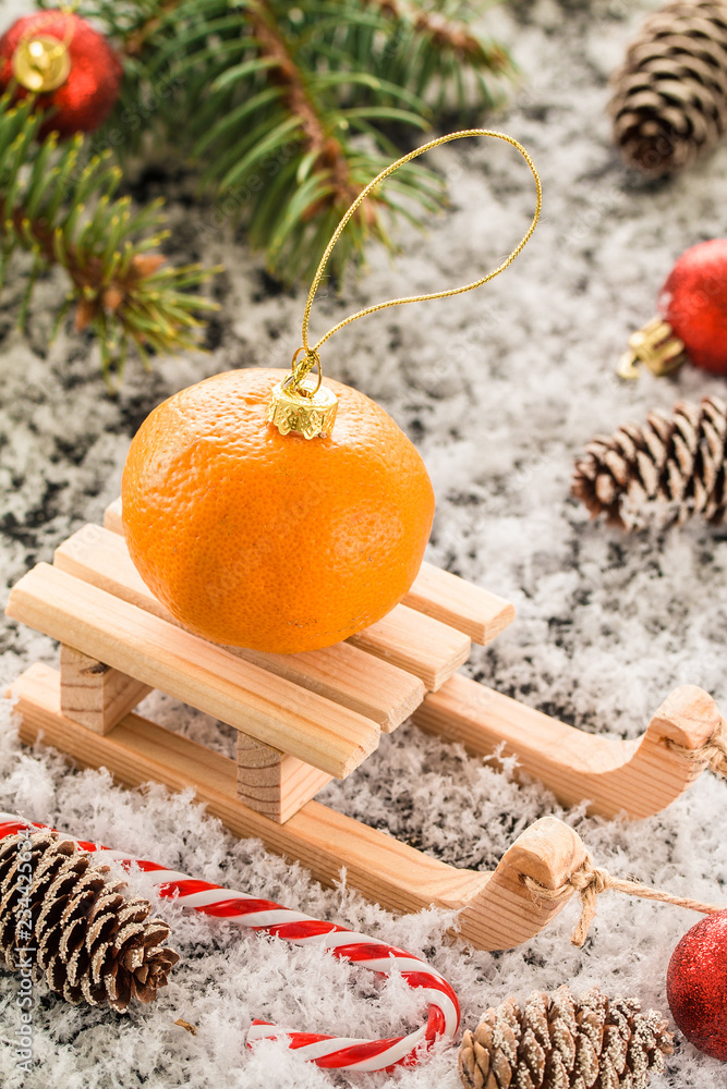 Christmas card with wooden sled, with fresh tangerin Christmas card with wooden sled, with fresh tangerin