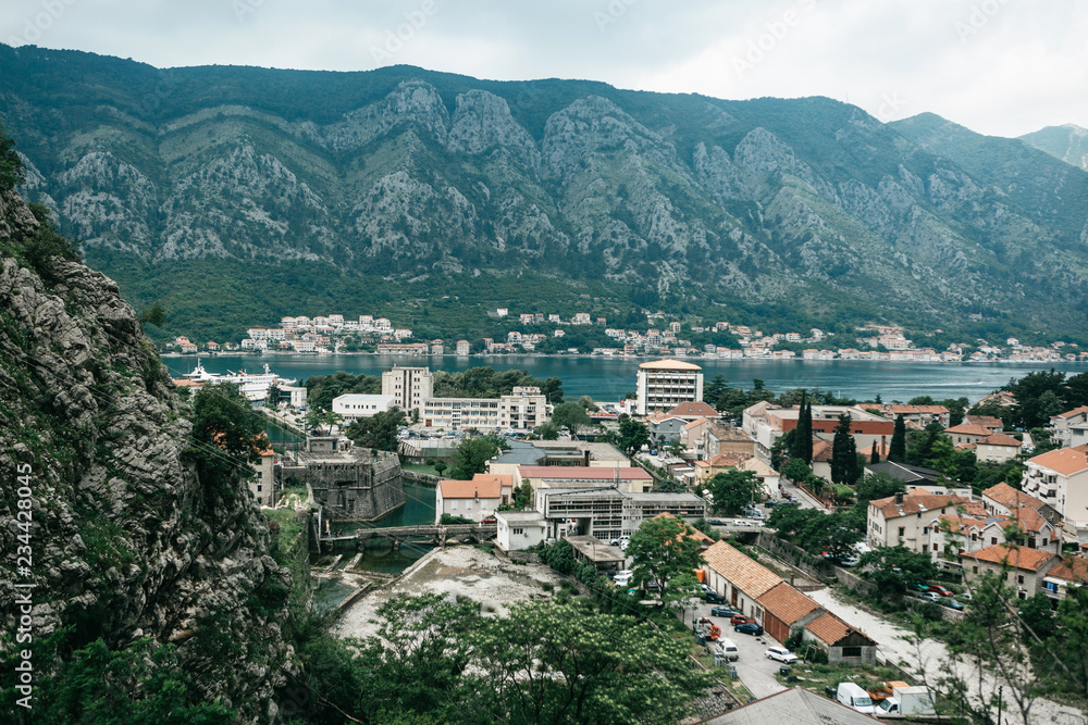 Aerial view of Kotor - a city on the Adriatic coast in Montenegro. One of the most beautiful coastal cities of Montenegro. Near a beautiful mountain landscape.