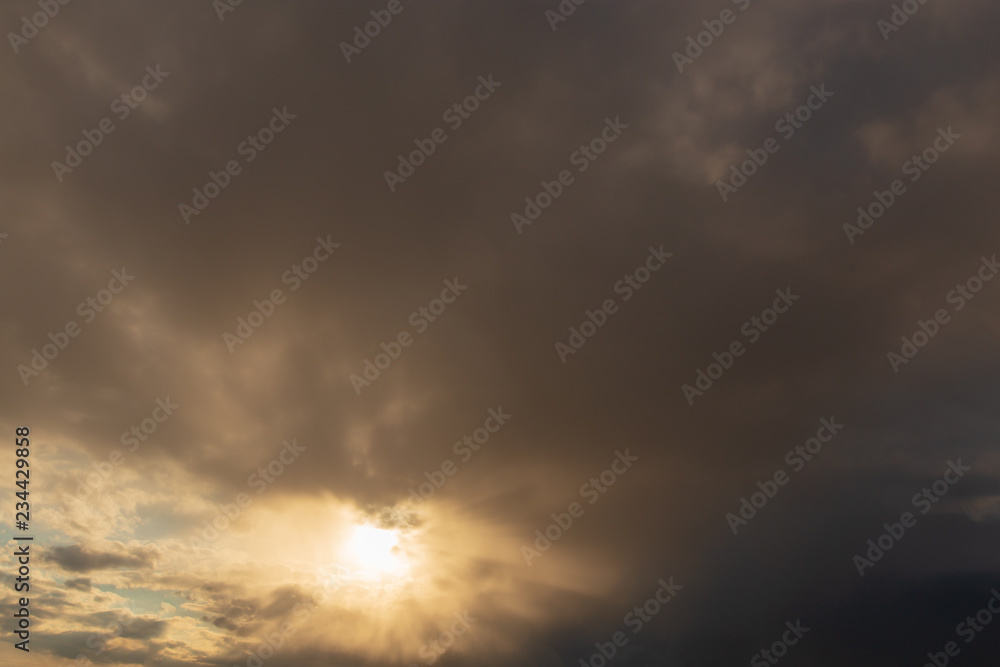 Naklejka premium Clouds after rain before sunset as a background
