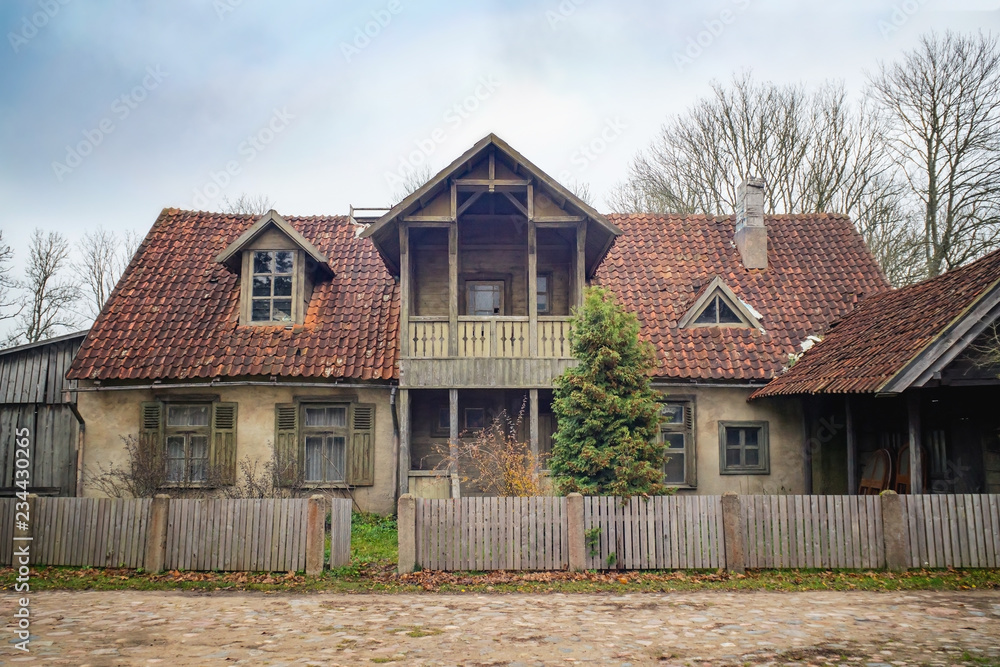 Old house with red clay tiles on a roof Old house with red clay tiles on a roof