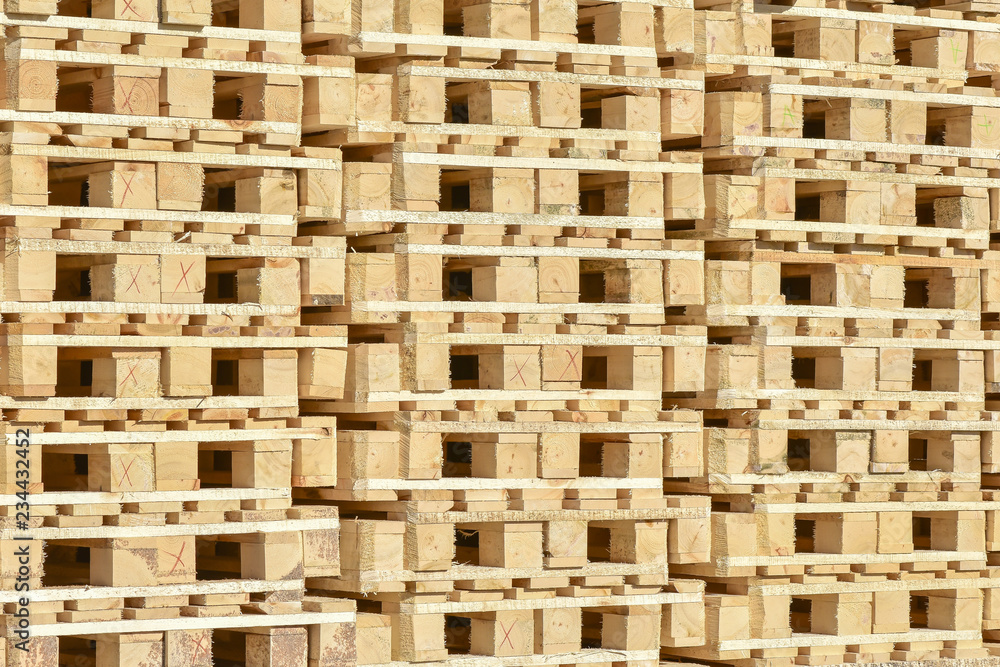 Stacked wooden pallets as background Stacked wooden pallets as background