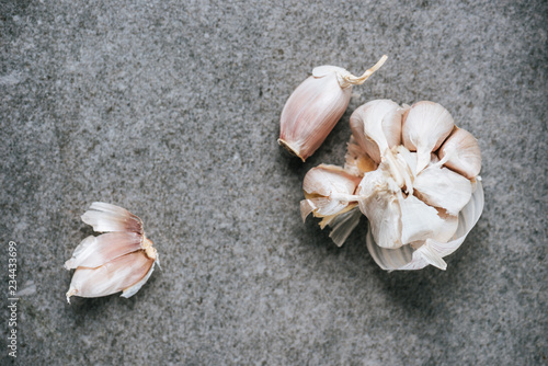 Wallpaper Mural top view of peeled ripe garlic bulb and several cloves on grey background Torontodigital.ca