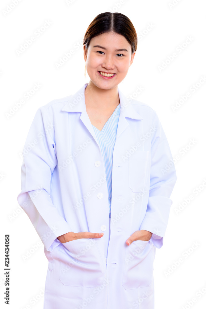 Studio shot of young happy Asian woman doctor smiling with hands Studio shot of young happy Asian woman doctor smiling with hands
