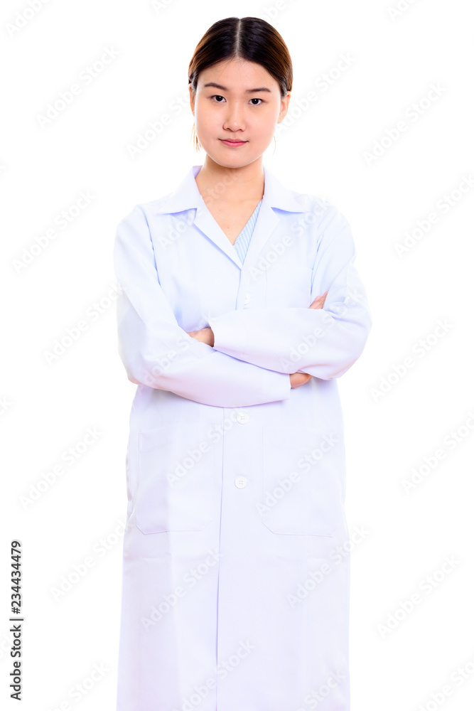 Studio shot of young beautiful Asian woman doctor standing with Studio shot of young beautiful Asian woman doctor standing with