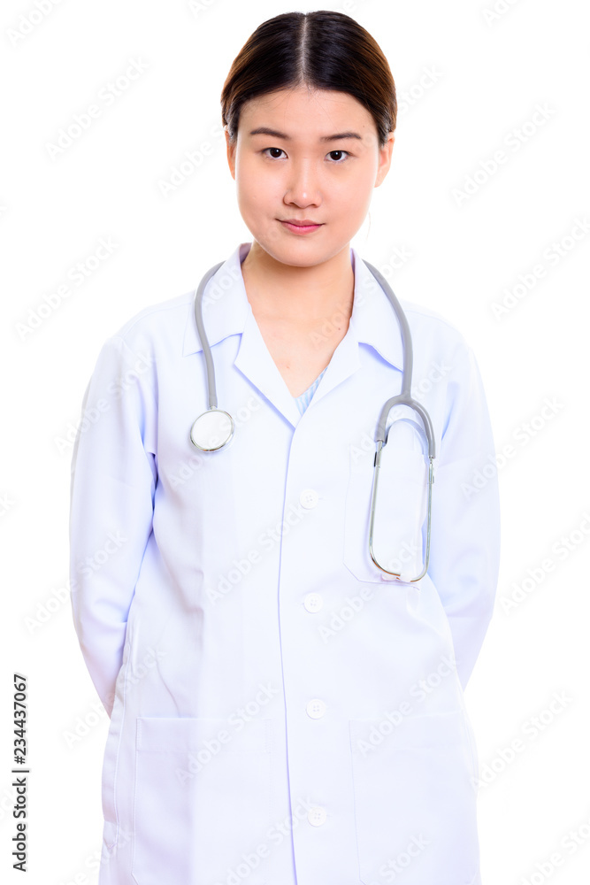 Studio shot of young beautiful Asian woman doctor with hands on Studio shot of young beautiful Asian woman doctor with hands on