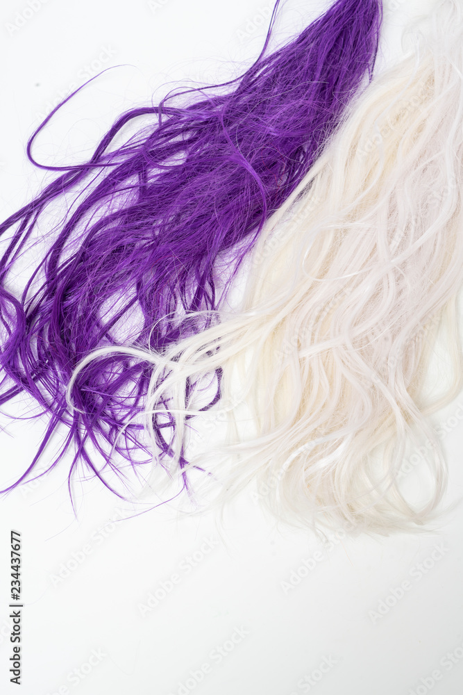long colored hair on a white surface long colored hair on a white surface