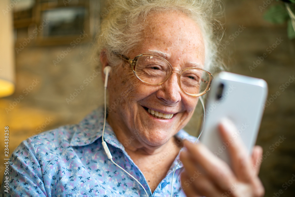 Cheerful senior woman making a video call Cheerful senior woman making a video call