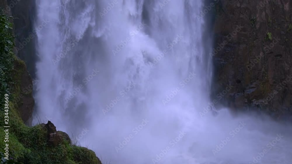 Waterfall in forest look clouds on land. Natural art of the world. Waterfall in forest look clouds on land. Natural art of the world.
