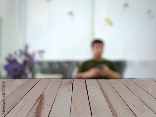 Selected focus empty brown wooden table and cooffe shop blur background with bokeh image photo