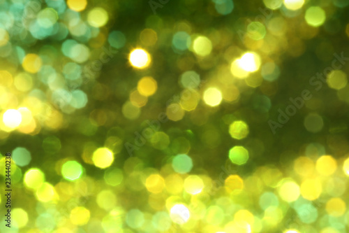 Christmas abstract gold bokeh background with light color in blur. © meepoohyaphoto