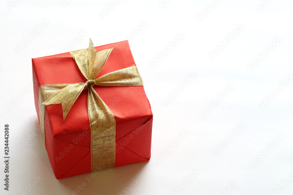 Red gift box isolated on white with close-up. Red gift box isolated on white with close-up.