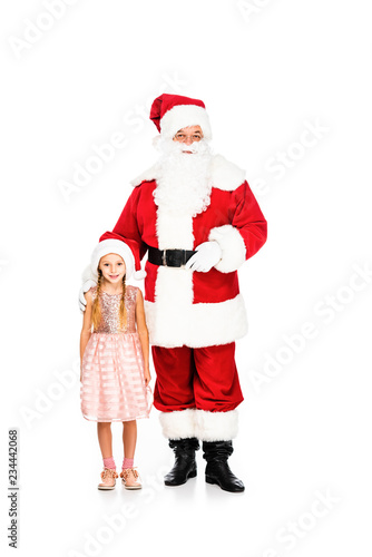 santa claus and little child looking at camera together isolated on white