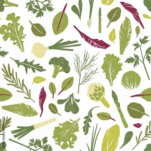 Seamless pattern with fresh green plants, vegetables, salad leaves and herbs on white background. Backdrop with healthy vegan products. Colored vector illustration for wrapping paper, fabric print.