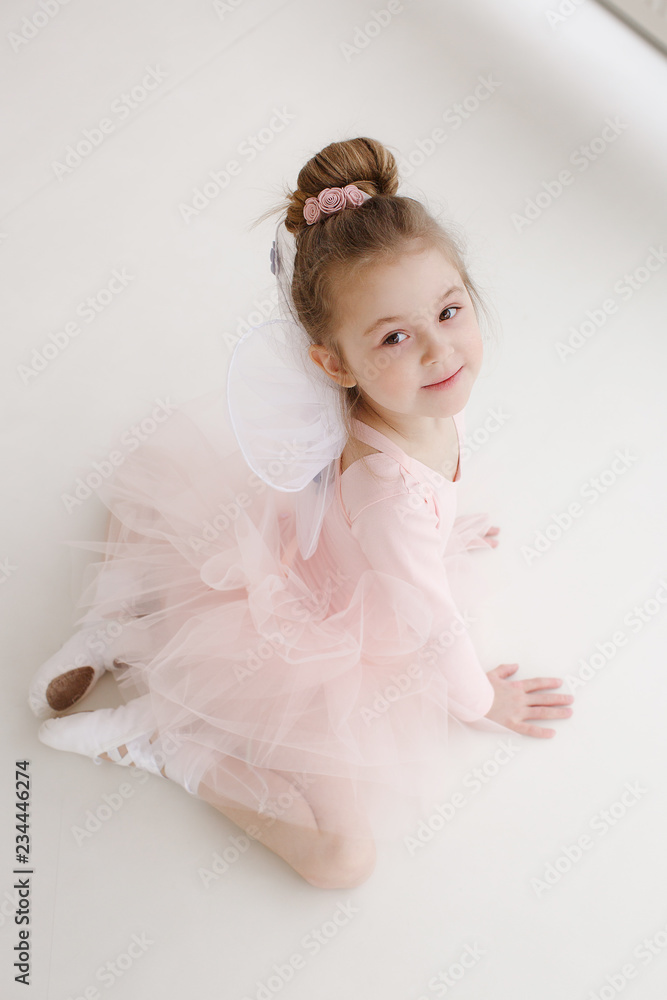 Little ballerina girl in a pink tutu. Adorable child dancing classical ballet in a white studio. Children dance. Kids performing. Young gifted dancer in a class. Preschool kid taking art lessons
Little ballerina girl in a pink tutu. Adorable child dancing classical ballet in a white studio. Children dance. Kids performing. Young gifted dancer in a class. Preschool kid taking art lessons