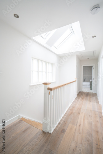 Bright hallway with stairs in a house