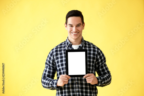 Young man with tablet compu...