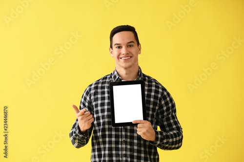 Young man with tablet compu...