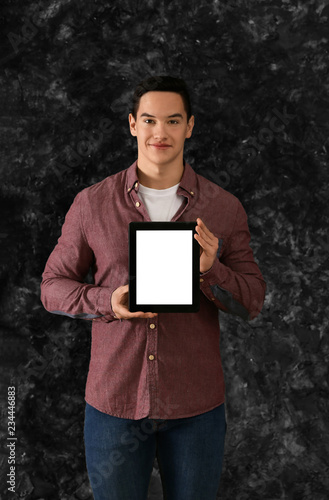 Young man with tablet compu...