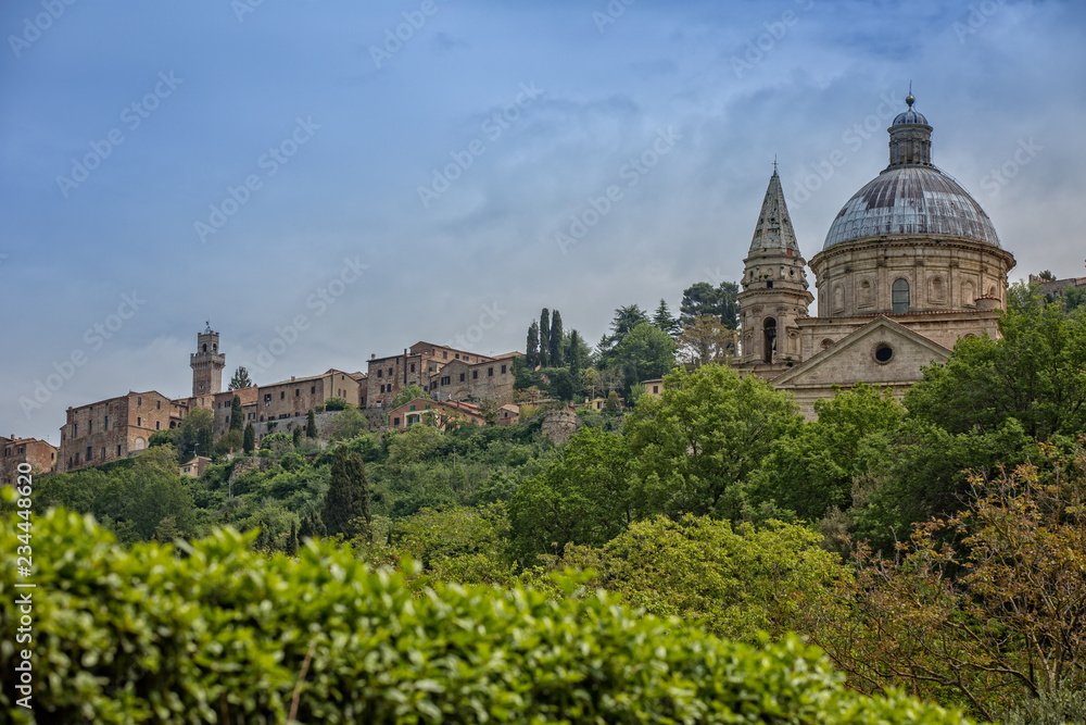 Church of the Madonna di San Biagio at the gates of Montepulciano. View of the church Madonna di San Biagio and of the hilltop town of Montepulciano in Tuscany, Italy