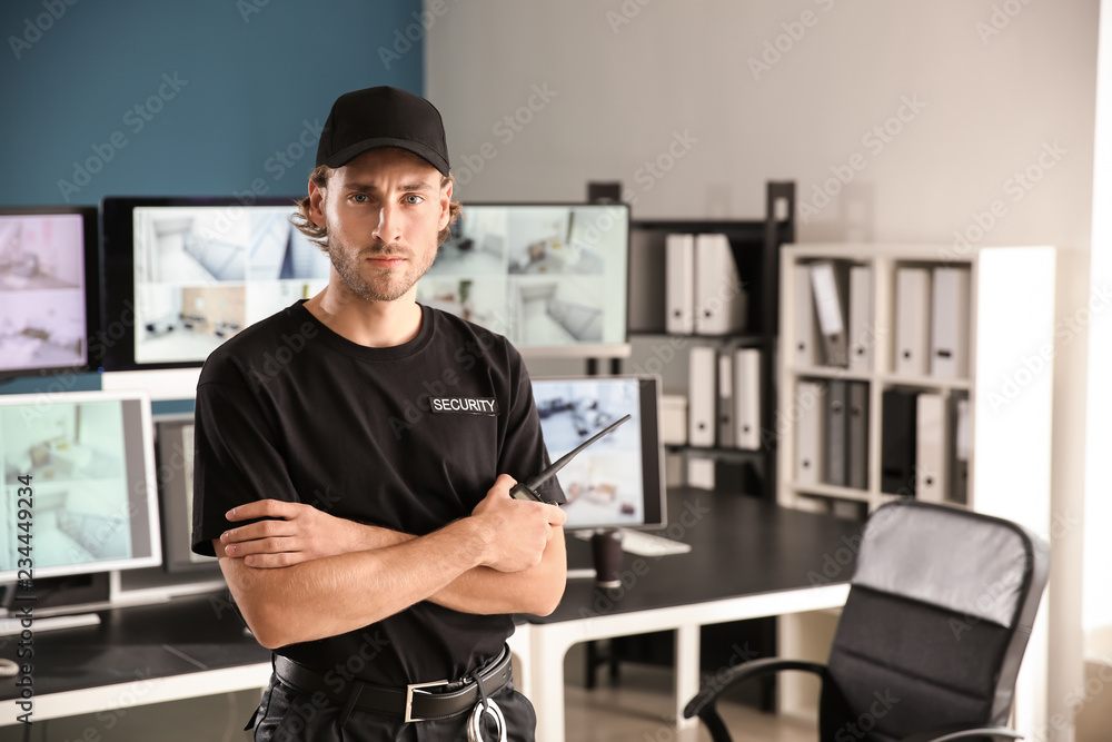 Security guard in surveillance room Security guard in surveillance room