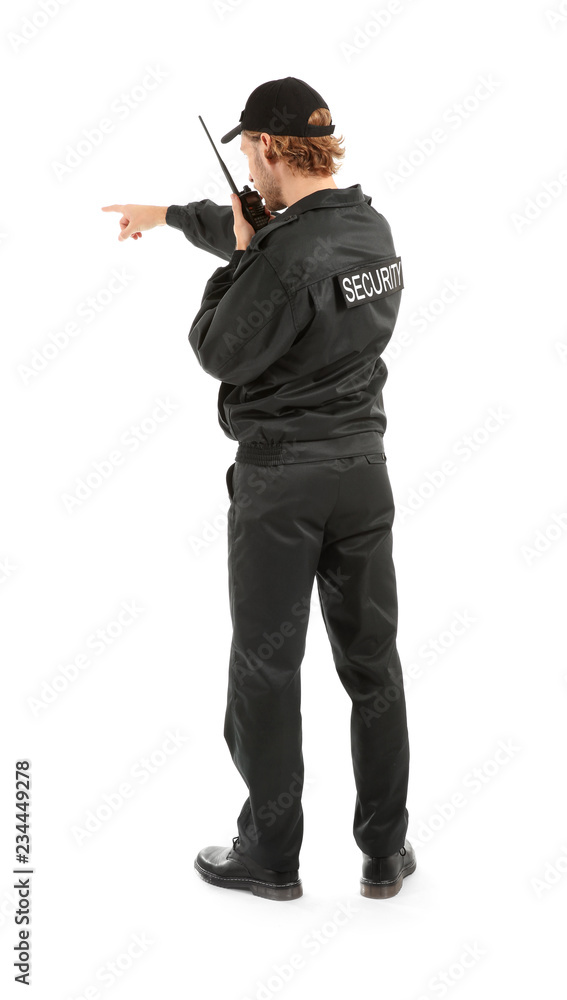 Male security guard with portable radio transmitter on white background